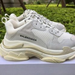 Replica Balenciaga Triple S Creamy White sneakers showcasing a high-quality design, featuring a blend of cream and white colors, perfect for sneaker enthusiasts seeking stylish replica sneakers.