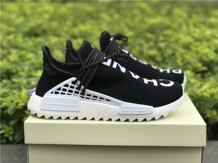 Chanel X Pharrell X Adidas Originals Hu NMD Black White replica sneakers featuring a sleek design with a combination of black and white colors, perfect for street style enthusiasts.
