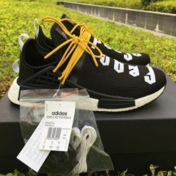 Fear Of God X Adidas NMD Pharrell Williams Human Race Black White replica sneakers featuring a sleek black and white design with bold branding and a comfortable silhouette ideal for casual wear and street style.