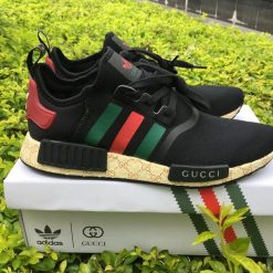 Gucci X Adidas NMD Boost Black replica sneakers featuring a sleek design with premium materials, showcasing a stylish blend of luxury and streetwear aesthetics.