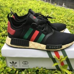 Gucci X Adidas NMD Boost Black replica sneakers featuring a sleek black design, combining luxury and street style with premium materials and intricate detailing, perfect for sneaker enthusiasts.