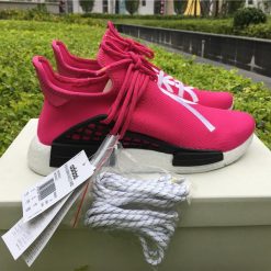 Pharrell X Adidas NMD Human Race Shock Pink replica sneakers featuring a vibrant pink design with bold text, high-quality materials, and signature branding perfect for sneaker enthusiasts.