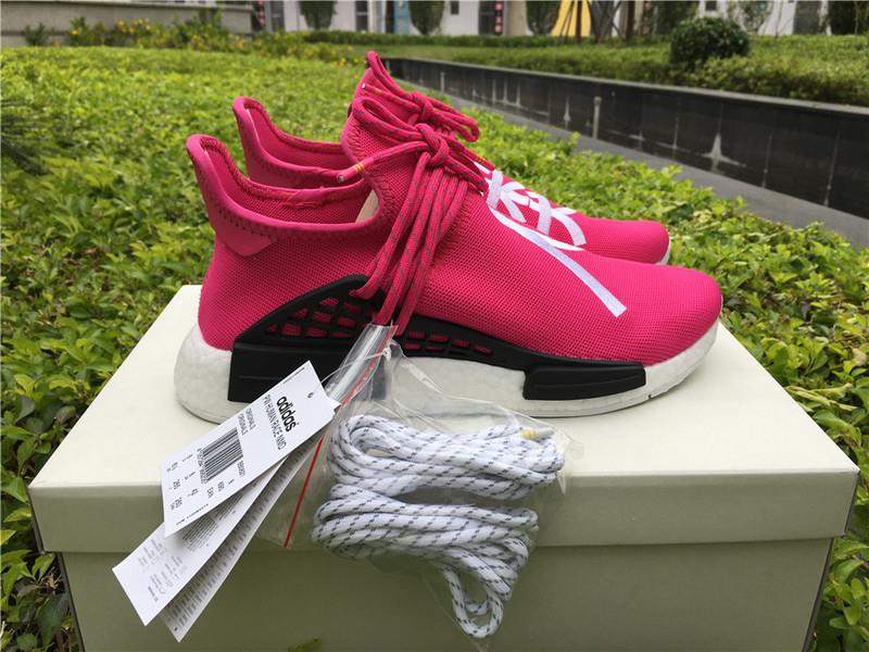 Pharrell X Adidas NMD Human Race Shock Pink replica sneakers featuring a vibrant pink design with bold text, high-quality materials, and signature branding perfect for sneaker enthusiasts.