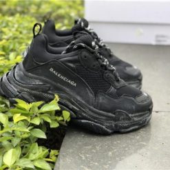 Balenciaga Triple S Trainer Black high-quality replica sneakers showcasing a sleek design, chunky silhouette, and premium materials, ideal for sneaker enthusiasts and fashion-forward individuals.