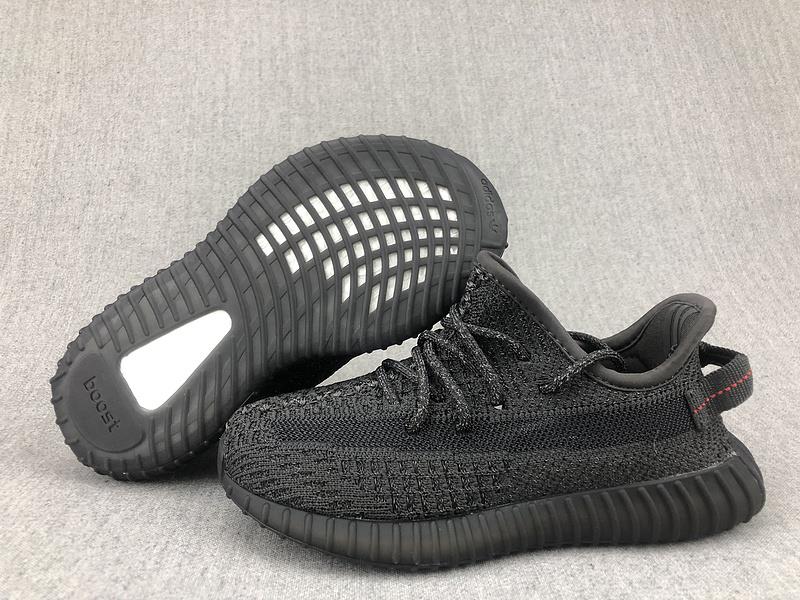 Adidas Yeezy Boost 350 V2 Black Kids replica sneakers featuring a sleek black design and signature stripe, perfect for young sneaker enthusiasts seeking stylish footwear.