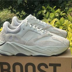 Adidas Yeezy Boost 700 Salt replica sneakers featuring a sleek gray and white design, with a cushioned sole and premium materials, perfect for sneaker enthusiasts seeking high-quality alternatives.