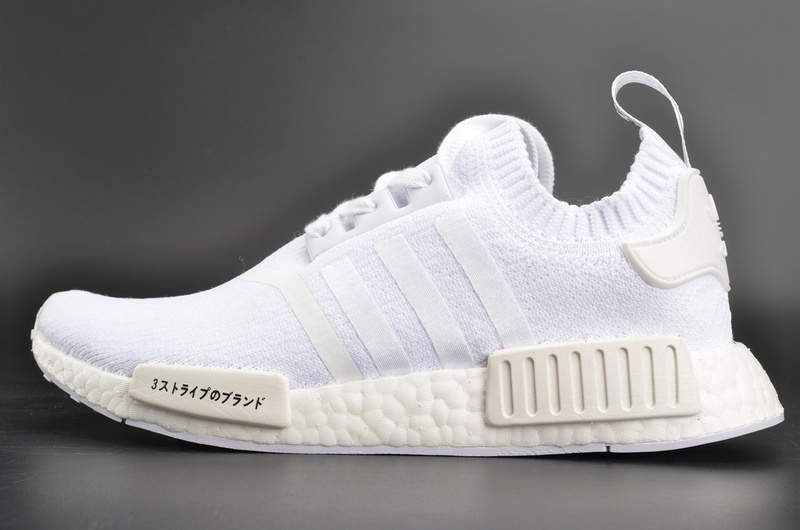 Adidas NMD R1 Primeknit Japan Triple White BZ0221 replica sneakers on display, featuring a sleek white design with prime knit upper and iconic NMD cushioning for a stylish and comfortable look.