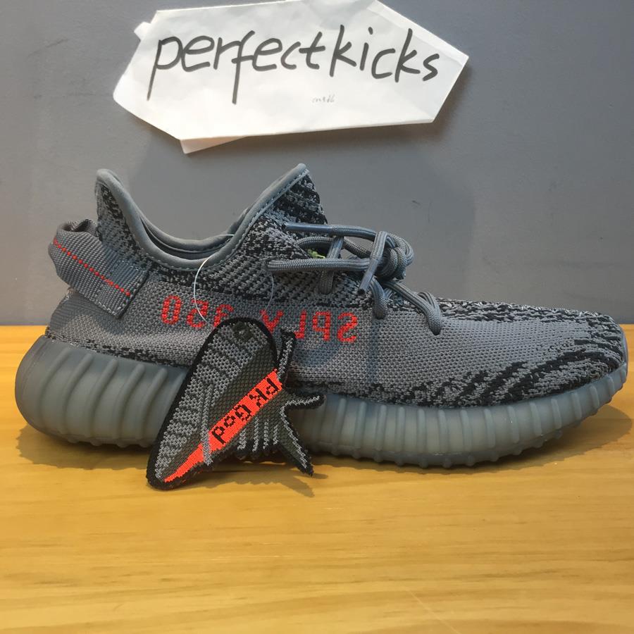 High-quality replica sneakers Adidas Yeezy Boost 350 V2 Beluga 2.0 featuring a stylish grey and orange colorway, showcasing the iconic striped design and comfortable Boost sole.