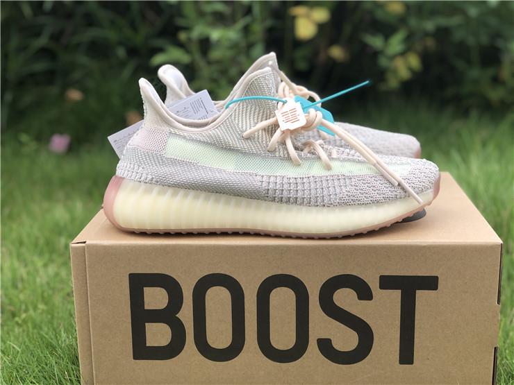 Adidas Yeezy Boost 350 V2 Citrin replica sneakers showcasing a light beige upper with reflective stripes, perfect for sneaker enthusiasts looking for high-quality alternatives.