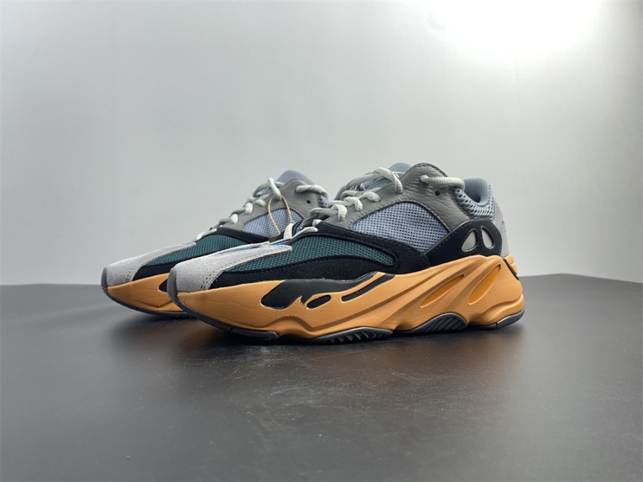 Adidas Yeezy Boost 700 Wash Orange replica sneakers showcasing a vibrant orange and neutral-toned upper, featuring a chunky sole design, perfect for sneaker enthusiasts looking for stylish and high-quality replicas.