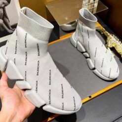 Balenciaga Speed 2.0 Allover Logo Beige Sneaker high-quality replica sneakers showcasing a stylish design with an allover logo pattern, perfect for fashion-forward individuals seeking comfort and luxury.