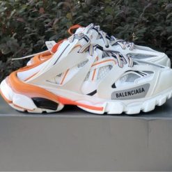 Balenciaga Track Mule White Orange Sneaker replica sneakers showcasing a sleek design with vibrant accents, perfect for stylish comfort and trendy streetwear.