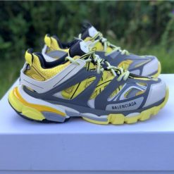 Replica Balenciaga Track Yellow Sneaker featuring a vibrant yellow colorway, designed as high-quality replica sneakers with intricate detailing and a sporty aesthetic, perfect for fashion-forward enthusiasts.