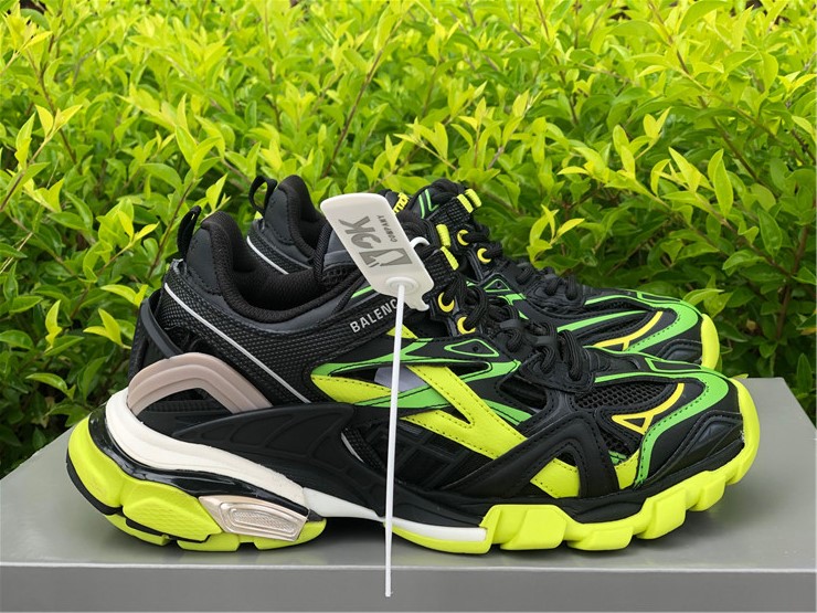 Balenciaga Track 2 Black Fluorescent Yellow Sneaker replica sneakers featuring a bold color combination, chunky design, and modern athletic style, perfect for sneaker enthusiasts seeking high-quality replicas.