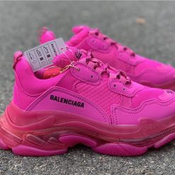 High-quality replica sneakers featuring the Balenciaga Triple S Clear Sole in a stylish pink colorway, showcasing a chunky silhouette and signature clear sole design.