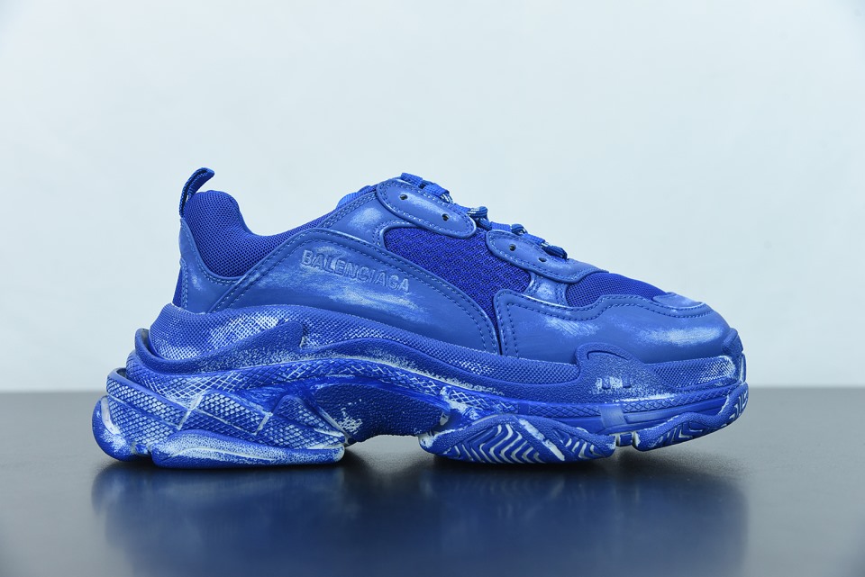 Balenciaga Triple S Faded Blue Sneaker showcasing an aesthetically worn design, perfect for sneaker enthusiasts seeking high-quality replica sneakers. The shoe features a combination of faded blue hues, textured materials, and the iconic chunky silhouette that Balenciaga is known for.