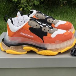 High-quality replica sneakers featuring the Balenciaga Triple S design in vibrant orange and yellow colors, showcasing a trendy and stylish look for sneaker enthusiasts.