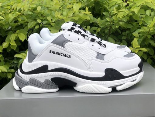 High-quality replica sneakers featuring the Balenciaga Triple S White Grey model, showcasing a stylish blend of white and grey materials with a chunky silhouette, perfect for fashion-forward enthusiasts.