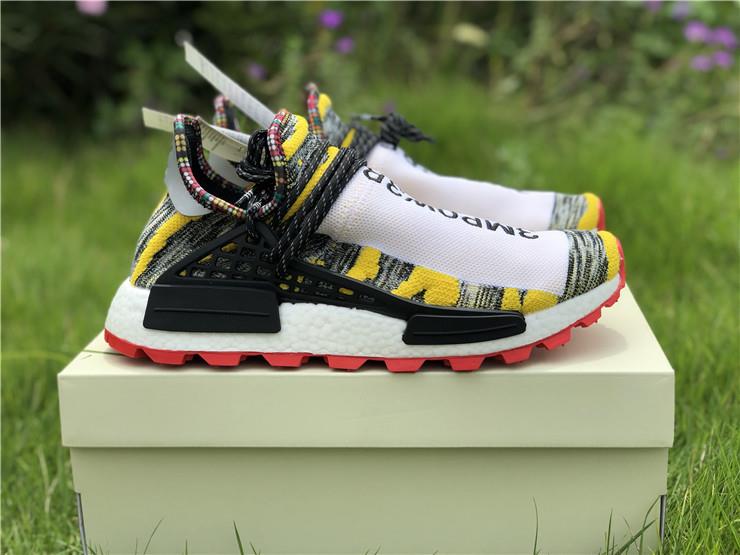 Pharrell Williams X Adidas Originals Human Race NMD Trail SOLARHU in White, Black, and Yellow, featuring a unique design perfect for stylish streetwear, high-quality replica sneakers for sneaker enthusiasts.