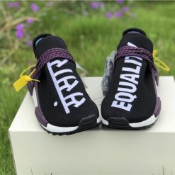 Pharrell X Adidas NMD Human Race Black Purple replica sneakers featuring a sleek black upper with vibrant purple accents and distinctive branding for a stylish, eye-catching look.
