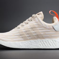 High-quality replica sneakers featuring the WMNS Adidas NMD R2 in Linen White, showcasing its stylish design and comfortable fit.