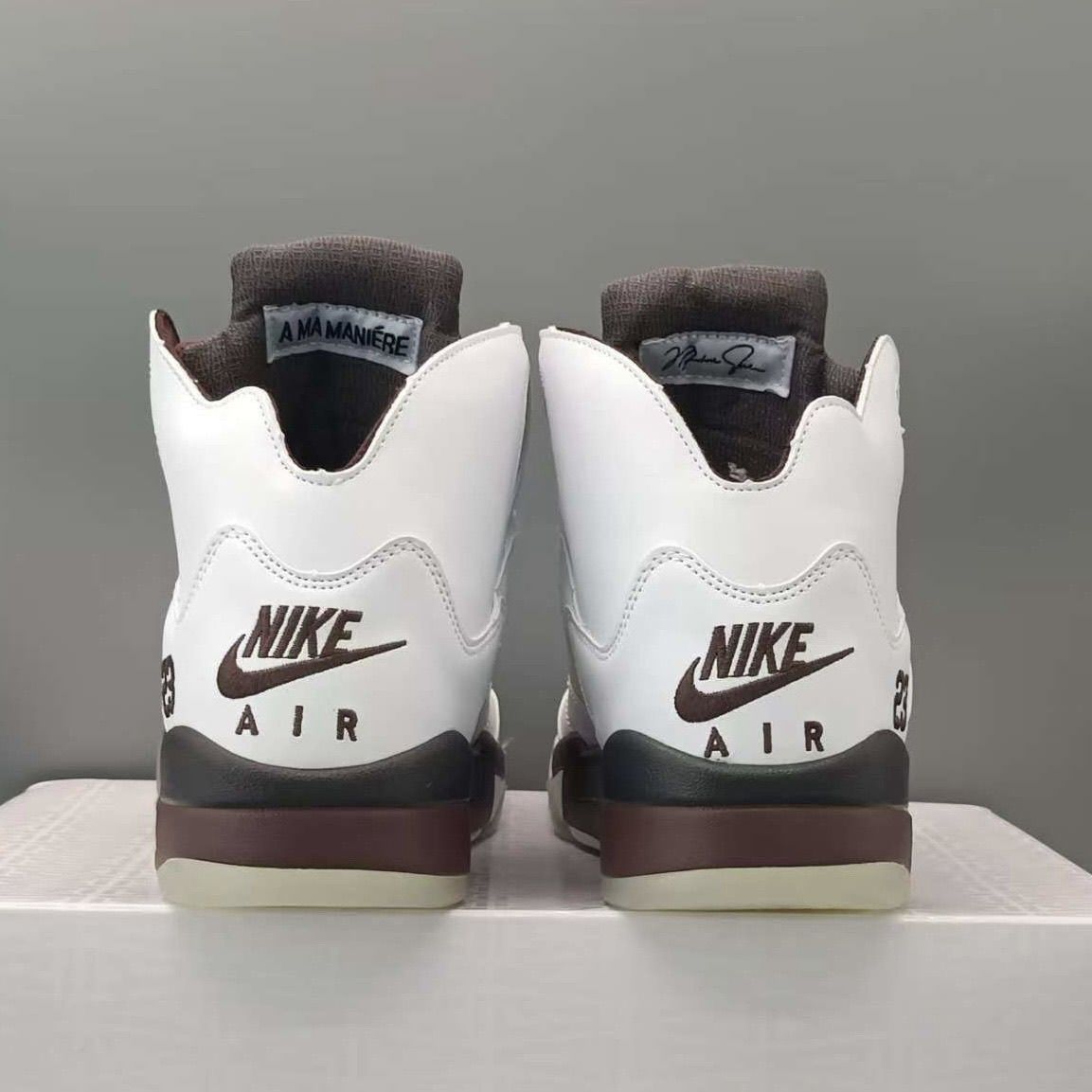 A Ma Maniére x Jordan 5 Retro OG 'Black Collective' replica sneakers featuring premium materials, a sleek black colorway, and intricate detailing for an authentic look.