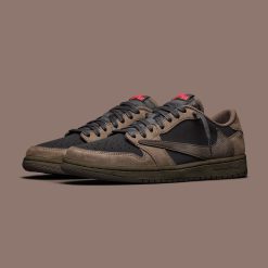The Travis Scott x Air Jordan 1 Low OG "Velvet Brown" is a conceptual sneaker that embodies the signature fusion of street style and high fashion that Travis Scott is known for. Although this specific colorway was not officially released, it is often discussed among sneaker enthusiasts and community members due to its unique design features and color palette. Conceptually, one might imagine the "Velvet Brown" version featuring luxurious materials such as a soft velvet upper in a deep brown hue, complemented by suede or nubuck accents for added texture. Signature features associated with Travis Scott collaborations could include: 1. **Reverse Swoosh**: A hallmark of Travis Scott's designs, the reversed Air Jordan Swoosh on one side of the shoe adds a distinctive twist to the classic silhouette. 2. **Co-branded Details**: The shoe could feature Travis Scott's Cactus Jack branding alongside the iconic Jumpman logo, possibly on the tongue or heel. 3. **Unique Lacing System**: Custom lacing options or additional lace sets in contrasting colors might be incorporated for personalization. 4. **Cushion and Comfort**: The Air Jordan 1 Low typically includes a cushioned midsole, and this concept might also include added comfort features to enhance wearability. 5. **Design Elements**: Potential reflective materials, special stitching, or embroidery could distinguish this model as part of the Travis Scott collaborative line. Overall, the Travis Scott x Air Jordan 1 Low OG "Velvet Brown" would likely appeal to sneakerheads looking for a mix of innovative design, luxury materials, and the cultural influence that both Travis Scott and the Air Jordan brand represent.